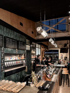 Communion Brewing Co. taproom Burnie Tasmania with craft beer taps and tasting paddles.