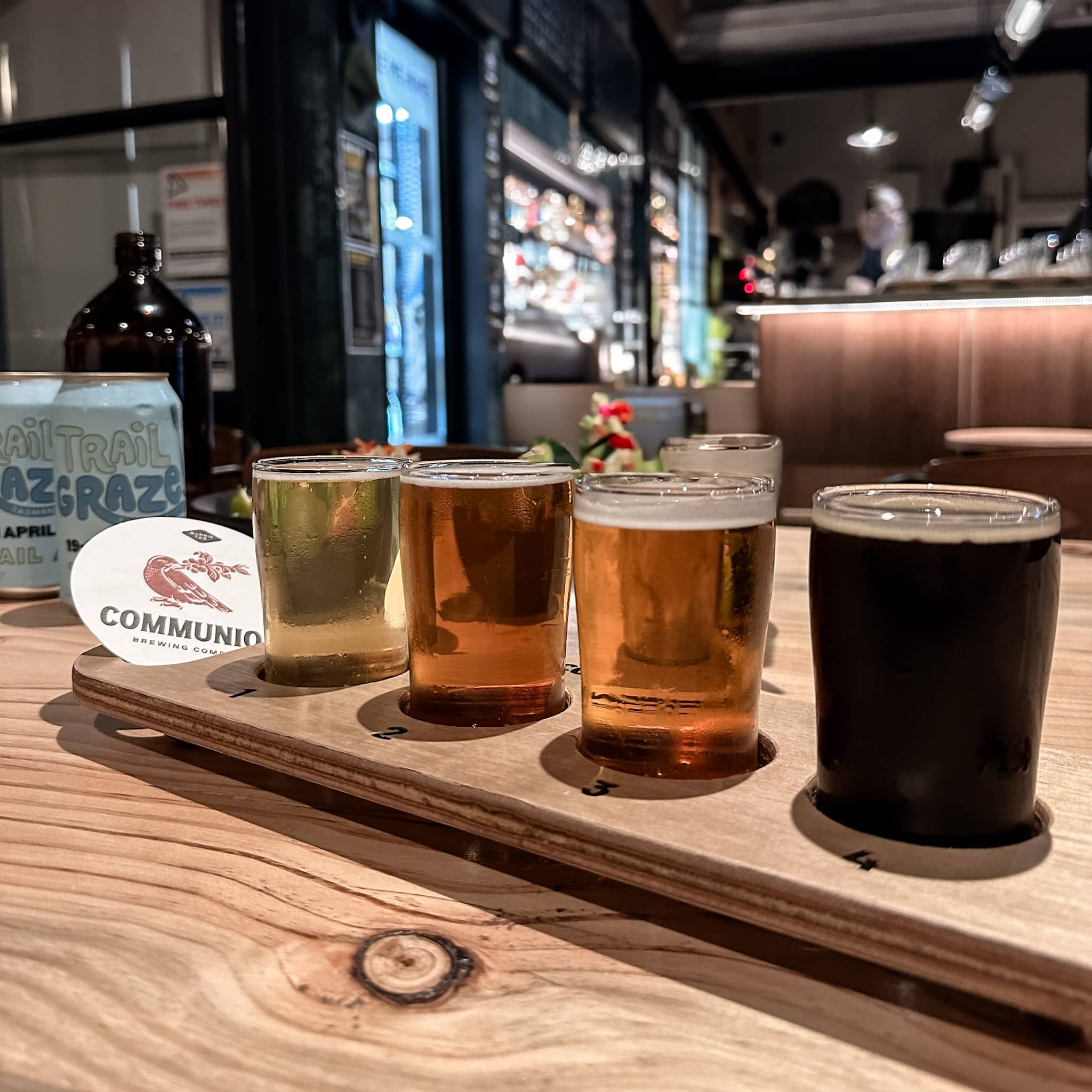 Flight of beer on a table at Communion Brewing.